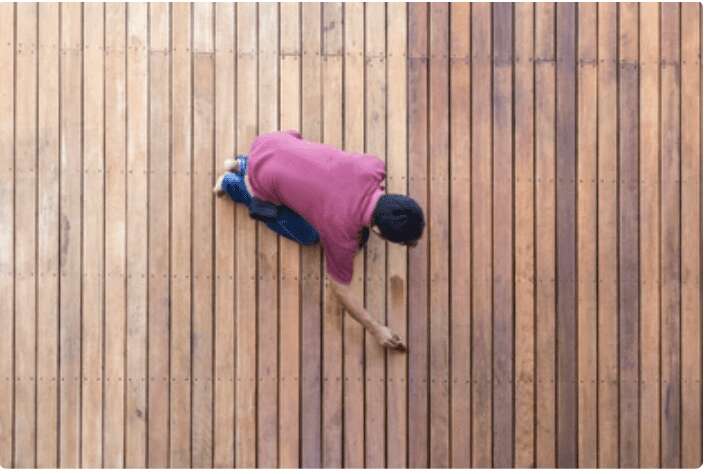 A Person fixing a pool deck repair near me
