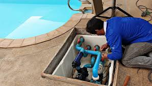 a technician fixing a pool equipment repair